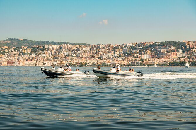 Aperitif on a boat at sunset in the Gulf of Naples - Castel dell’Ovo at golden hour: the Naples classic from the water