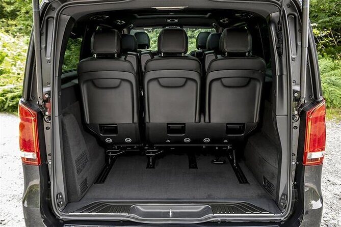 Arrival by Luxury Van from Fiumicino airport FCO to Rome City - The Luxury Van Ride: Comfort, Water, and English Help