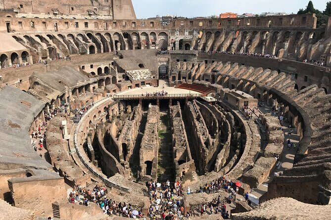 Best of Rome: Private Tour with Hotel Pick Up - Entering the Colosseum: ground level and the first tier