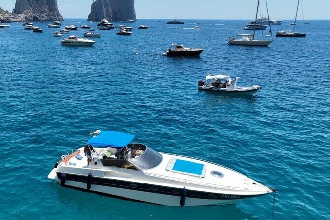 Capri by Boat: Private Tour of the Blue Grotto and Faraglioni - The included onboard setup: skipper, music, snorkeling, and aperitif