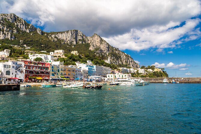 Capri Tour from Pompeii, Vico Equense & Castellammare di Stabia - The boat tour around Capri: Faraglioni and the Love Arch from close range
