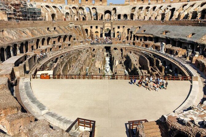 Colosseum Gladiator's Arena and Ancient Rome VIP Guided Tour - Roman Forum Stop: Temples, Center Aisles, and Julius Caesar