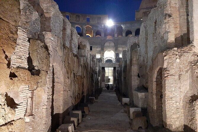 Colosseum Night Tour with Underground and Arena access - The arena floor at night and the Gate of Death