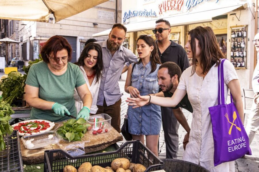 Rome: Campo de Fiori, Jewish Ghetto and Trastevere Food Tour - The Spirito di Divino meal: pasta, porchetta, wine, and that wine cellar