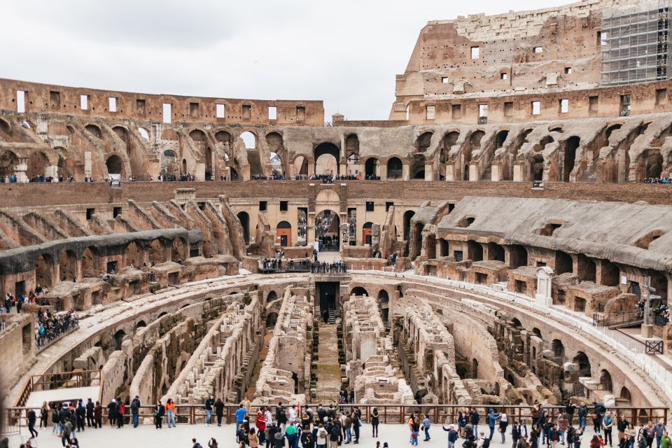 Rome: Colosseum, Palatine Hill & Roman Forum Guided Tour - The Roman Forum Walk: Arch of Titus, Vestal Virgins, and Caesar