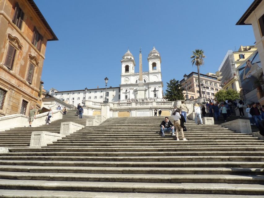 Rome: Guided Walking Tour and River Boat Ride - Trastevere first: market snacks, church art, and cobblestones