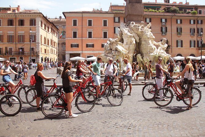 Rome Highlights Bike Tour 3 Hour City Cycling Experience - Stop 1: Foro Romano and the layers of ancient Rome