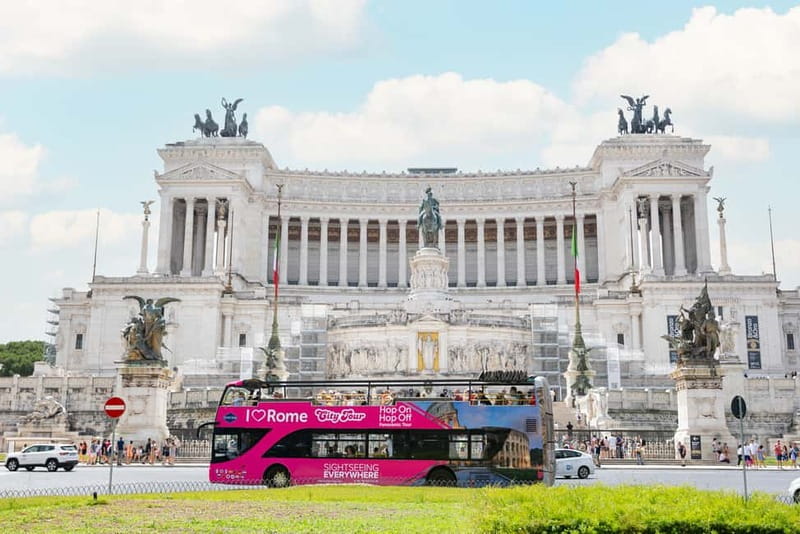Rome: Hop-on Hop-off Sightseeing Bus Tour with Audioguide - The pink buses: comfort, views, and how the audio actually helps