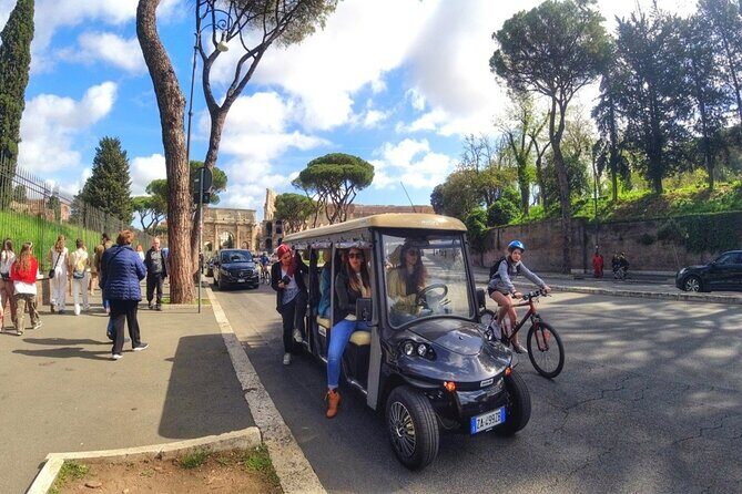 Rome Night Tour Highlights by Luxury Golf Cart - Trevi Fountain after dark: coin time and getting closer