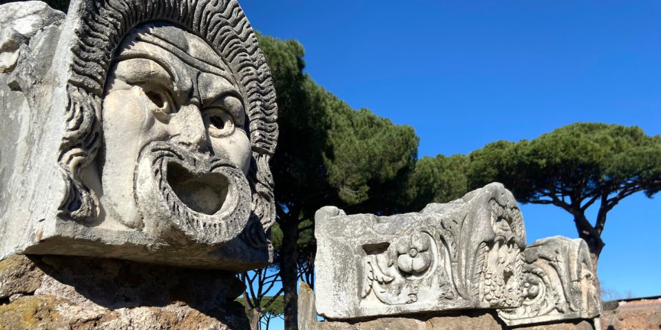 Rome: Ostia Antica Guided Tour in German with Tickets - Ancient buildings and street-level life you can actually picture