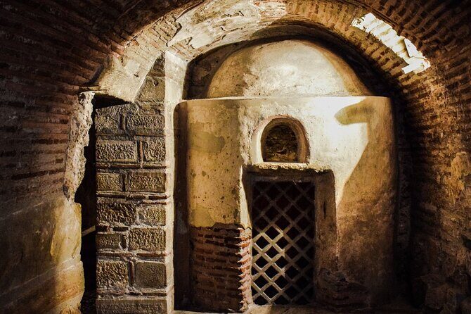 Rome Private Golf Cart tour of Catacomb and Ancient Appian Way - The start of Via Appia Antica: old paving, tombs, and the San Sebastiano gate