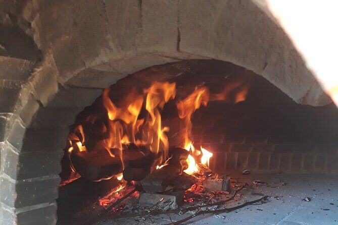 Rome: Wine Tour & Pizza Making Class in a Frascati's vineyard - 5 hours - The winery visit: vineyard views and a 1712 winemaking legacy