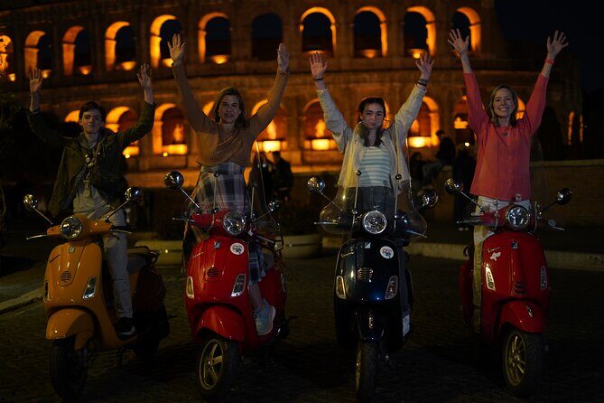 Vespa Scooter Night Tour in Rome with Professional Photographer - The Colosseum at night: first stop, first photos
