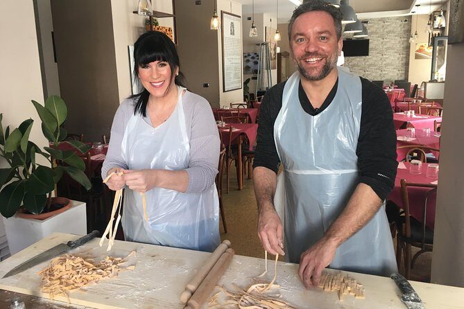 Walking tour in the Heart of Rome and a Cooking Class in a Very Small Group - Trevi Fountain and the ancient aqueduct ruins you pass on the way